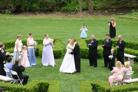 Wedding ceremony in boxwood garden